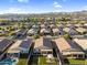 Aerial view of neighborhood featuring manicured lawns, covered patios, putting green and beautiful mountain views at 1747 E Grove St, Phoenix, AZ 85040