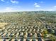 Wide aerial view of neighborhood featuring manicured lawns and beautiful mountain views at 1747 E Grove St, Phoenix, AZ 85040