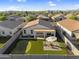Aerial view of backyard featuring a putting green, patio seating area, and covered patio at 1747 E Grove St, Phoenix, AZ 85040