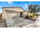 Charming single-story home featuring a neutral color scheme, low maintenance landscaping, and attached two car garage at 1747 E Grove St, Phoenix, AZ 85040