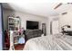 Bedroom featuring wood floors, a ceiling fan, and a view of the dresser and the bookcase at 1802 W Isleta Ave, Mesa, AZ 85202