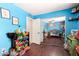 A vibrant blue bedroom featuring unique, themed decorations and ample toy storage at 1802 W Isleta Ave, Mesa, AZ 85202