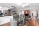 Bright dining area with tile floors, stainless steel appliances, and access to other rooms at 1802 W Isleta Ave, Mesa, AZ 85202
