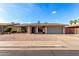 Charming single-story home with a well-maintained front yard and a two-car garage at 1802 W Isleta Ave, Mesa, AZ 85202