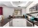 Bright kitchen featuring stainless steel appliances, light cabinetry, and dark countertops at 1802 W Isleta Ave, Mesa, AZ 85202