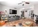 Open-concept living room with tile floors, entertainment center and plenty of space at 1802 W Isleta Ave, Mesa, AZ 85202