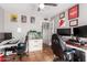 Bright office featuring dual workstations, ceiling fan and ample wall decorations at 1802 W Isleta Ave, Mesa, AZ 85202