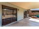 Covered patio with sliding glass doors and access to backyard at 1802 W Isleta Ave, Mesa, AZ 85202