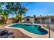 Large backyard pool, surrounded by concrete and gravel, perfect for outdoor recreation at 1802 W Isleta Ave, Mesa, AZ 85202
