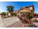 Charming home featuring a low-maintenance landscape and a two-car garage at 181 N 222Nd Dr, Buckeye, AZ 85326