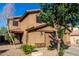 Attractive exterior with a well-manicured lawn and an attached two-car garage at 181 N 222Nd Dr, Buckeye, AZ 85326