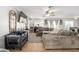Comfortable living area featuring neutral colors, tile flooring and a ceiling fan at 181 N 222Nd Dr, Buckeye, AZ 85326