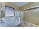 Well-lit bathroom featuring a soaking tub and a separate shower at 18195 W Marshall Ln, Surprise, AZ 85388