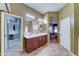 Bathroom with dual sinks, granite countertops, and ample cabinet space at 18195 W Marshall Ln, Surprise, AZ 85388