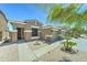 Charming single-story home featuring a well-manicured front yard with desert landscaping at 18195 W Marshall Ln, Surprise, AZ 85388