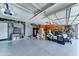 Spacious garage with epoxy floor and storage cabinets, offering ample space for vehicles and storage at 18195 W Marshall Ln, Surprise, AZ 85388