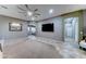 Bright and open living room with neutral walls, plush carpeting, and stylish fixtures at 18195 W Marshall Ln, Surprise, AZ 85388
