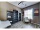 Home office with hardwood floors, natural light and built-in bookshelves for storage at 18195 W Marshall Ln, Surprise, AZ 85388