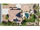 Aerial view of house with solar panels, backyard pool, spa, and landscaped yard at 18329 W Montebello Ave, Litchfield Park, AZ 85340