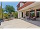 Covered patio featuring comfortable seating with a view of the manicured yard at 18329 W Montebello Ave, Litchfield Park, AZ 85340