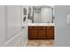Bathroom vanity with double sinks, granite countertop, and wood cabinets at 18329 W Montebello Ave, Litchfield Park, AZ 85340