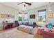 Bright bedroom with a large window, string lights, and fun decorations at 18329 W Montebello Ave, Litchfield Park, AZ 85340