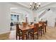 Formal dining room with elegant chandelier, and easy access to the living room and foyer at 18329 W Montebello Ave, Litchfield Park, AZ 85340