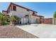 Two story home with a basketball hoop, storage shed and gated driveway at 18329 W Montebello Ave, Litchfield Park, AZ 85340