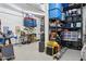 Organized garage with a work bench and lots of storage for tools, bins, and other equipment at 18329 W Montebello Ave, Litchfield Park, AZ 85340