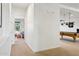 Hallway leading to a bedroom and a game room with a pool table at 18329 W Montebello Ave, Litchfield Park, AZ 85340