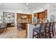 This kitchen has an island with bar seating and stainless steel appliances at 18329 W Montebello Ave, Litchfield Park, AZ 85340