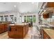 Gourmet kitchen features granite counters, an oversized island, and stainless steel appliances for culinary enthusiasts at 18329 W Montebello Ave, Litchfield Park, AZ 85340