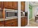 This kitchen features a built-in microwave and granite countertops at 18329 W Montebello Ave, Litchfield Park, AZ 85340