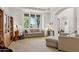 Comfortable living room with large windows, neutral-toned furniture, and stylish decor accents at 18329 W Montebello Ave, Litchfield Park, AZ 85340