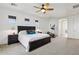 Bright, spacious main bedroom suite with a king bed, exercise equipment and ensuite access at 18329 W Montebello Ave, Litchfield Park, AZ 85340