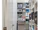 A walk-in pantry is well-organized with shelving at 18329 W Montebello Ave, Litchfield Park, AZ 85340