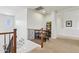 Cozy upstairs landing features a seating area and game shelf at 18329 W Montebello Ave, Litchfield Park, AZ 85340