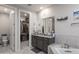 This bathroom features granite counters, double sinks, a walk-in closet and separate toilet room at 18493 W Hiddenview Dr, Goodyear, AZ 85338