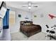 Bedroom with a ceiling fan, dinosaur decor, and a pull-out trundle bed at 18493 W Hiddenview Dr, Goodyear, AZ 85338