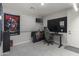Spare bedroom with tile flooring, a ceiling fan, and a gamer themed desk setup at 18493 W Hiddenview Dr, Goodyear, AZ 85338