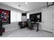 Bedroom featuring a desk, chair, tv, and decor at 18493 W Hiddenview Dr, Goodyear, AZ 85338