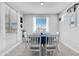 Bright dining room with seating for six and views of the desert landscape at 18493 W Hiddenview Dr, Goodyear, AZ 85338