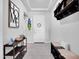Modern entryway with stylish decor, functional furniture, and a welcoming atmosphere, creating a great first impression at 18493 W Hiddenview Dr, Goodyear, AZ 85338