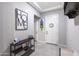 Inviting entryway with decorative console table and modern decor elements at 18493 W Hiddenview Dr, Goodyear, AZ 85338