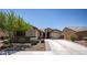 Charming single story home featuring desert landscaping and a spacious driveway in a desirable neighborhood at 18493 W Hiddenview Dr, Goodyear, AZ 85338
