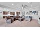 Spacious living area with an open floor plan, seamless transition into the kitchen, and comfortable seating arrangement at 18493 W Hiddenview Dr, Goodyear, AZ 85338
