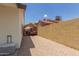 Spacious driveway area with gravel, a boat with cover, and a block wall at 19 W Wickieup Ln, Phoenix, AZ 85027