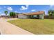 Charming single-story home with a two-car garage, well-maintained lawn, and lovely curb appeal on a sunny day at 19 W Wickieup Ln, Phoenix, AZ 85027