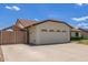 Charming single-story home with a two-car garage, well-maintained lawn, and a large driveway on a sunny day at 19 W Wickieup Ln, Phoenix, AZ 85027