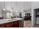 Bright, open kitchen with island sink and plenty of open living space at 19 W Wickieup Ln, Phoenix, AZ 85027